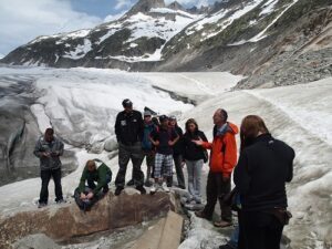 Uwe Kackstaetter lecturing to students at the Rhone Glacier in the Alps i Switzerland