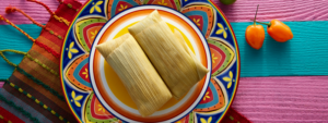 Plate of Tamales on a brightly color plate and tablecloth