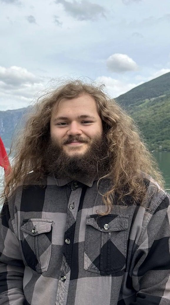 Bjorn smiles in a fjord