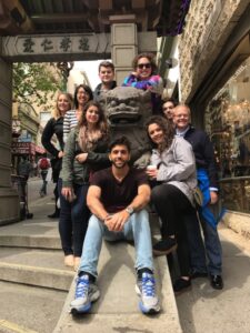 MSU Denver Model UN students pose with a dragon statue