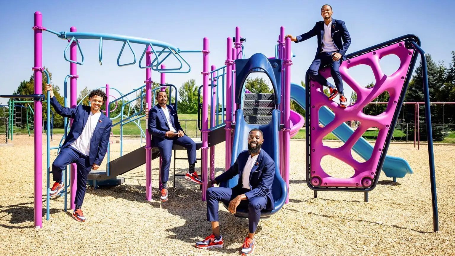 Call Me MISTER leaders sitting on a pink playground. From left to right: MSU Denver’s Jordan Puch, Christopher Livingston, Rashad Anderson and Joshua Barringer are part of Call Me MISTER, a highly respected teacher-leadership program dedicated to recruiting, training and placing African American male teachers. Photo by Alyson McClaran