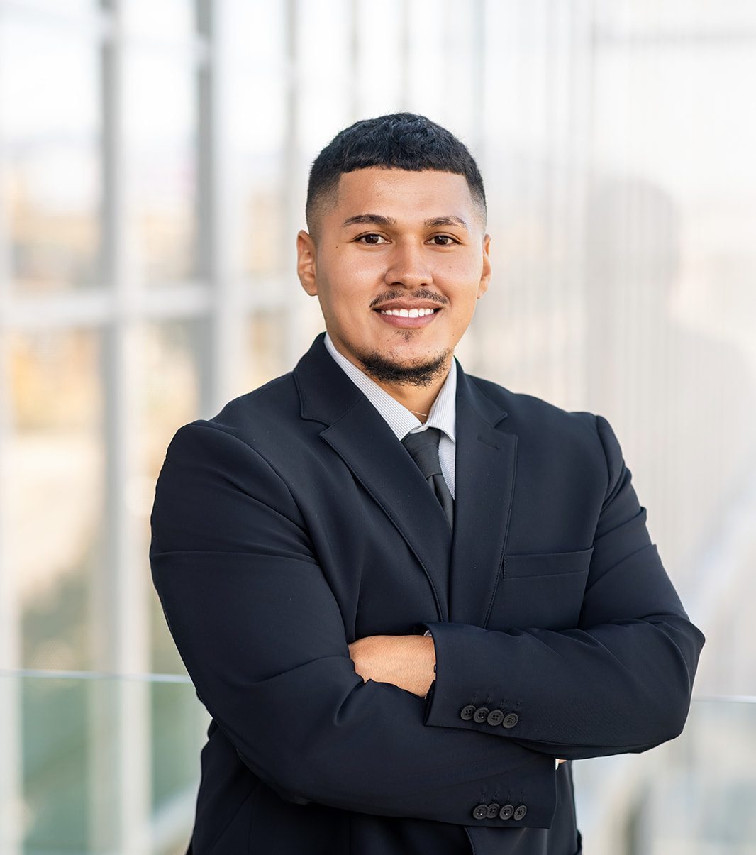 Rene Dominguez, standing with arms crossed