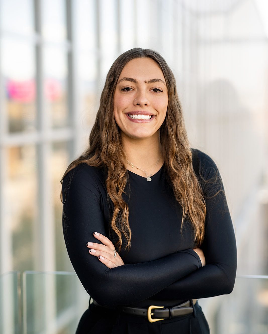 Sofia Nazarenus professional portrait, standing with arms crossed.
