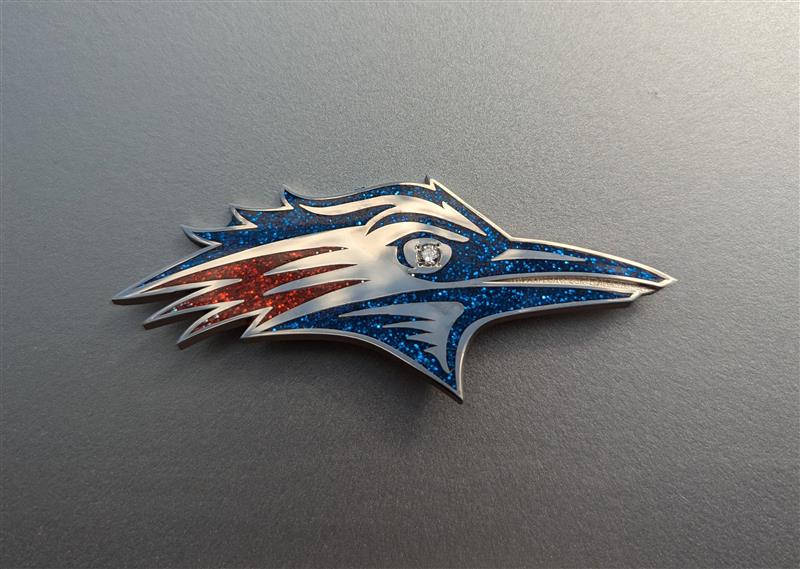 A Roadrunner brooch, full color version of the bird head logo
