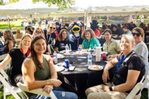 Nurse Rowdy surrounded by friends at the CHHS Week Lunch on the Lawn, Sept. 3 2024