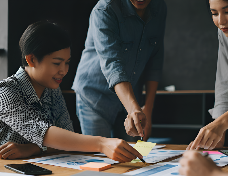 Three people collaborating