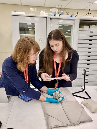 Fall 2024 College of Letters, Arts, and Sciences Graduate Honoree Krista Allen, right, digging into some research archives with Professor Jill Mollenhauer, looking at the collection at the Dumbarton Oaks Museum in Washington DC.