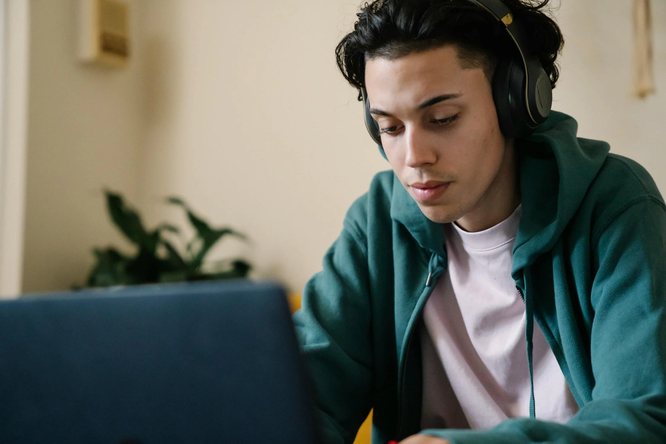 Student looking at computer in a room.