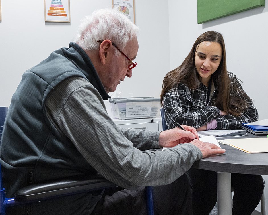 Graduate clinician working with elderly client