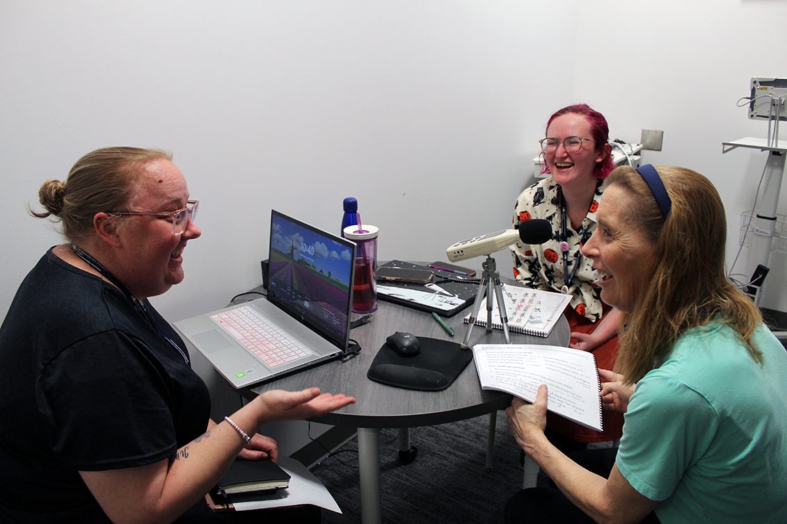 Clinical educator (left), graduate clinician (middle) and client (right) working on Parkinson Voice Therapy