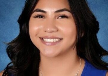 picture of a young woman in a blue shirt.