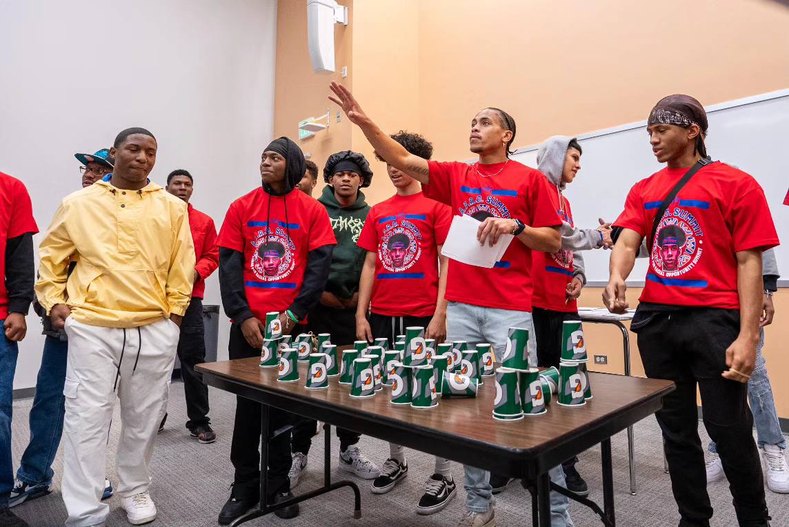 Call Me MiSTER mentors playing games with students