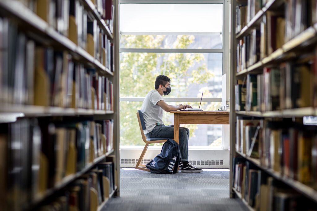 Student in library studying