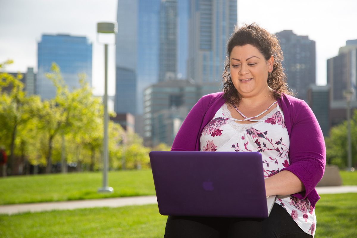 Student on computer is Ruth Delgado.