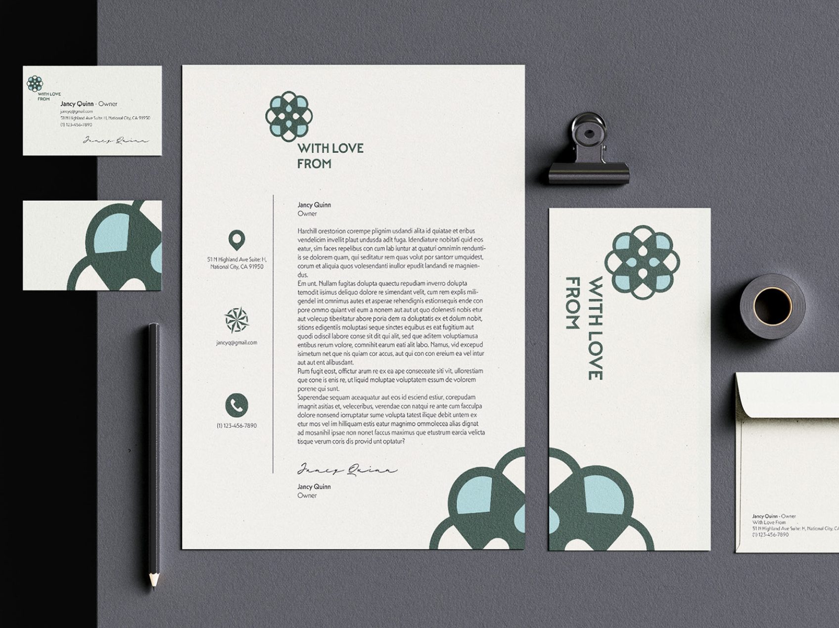 A collection of business identity assets, including business cards and stationary with unique custom logo.