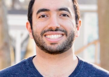 Picture of man in blue shirt smiling