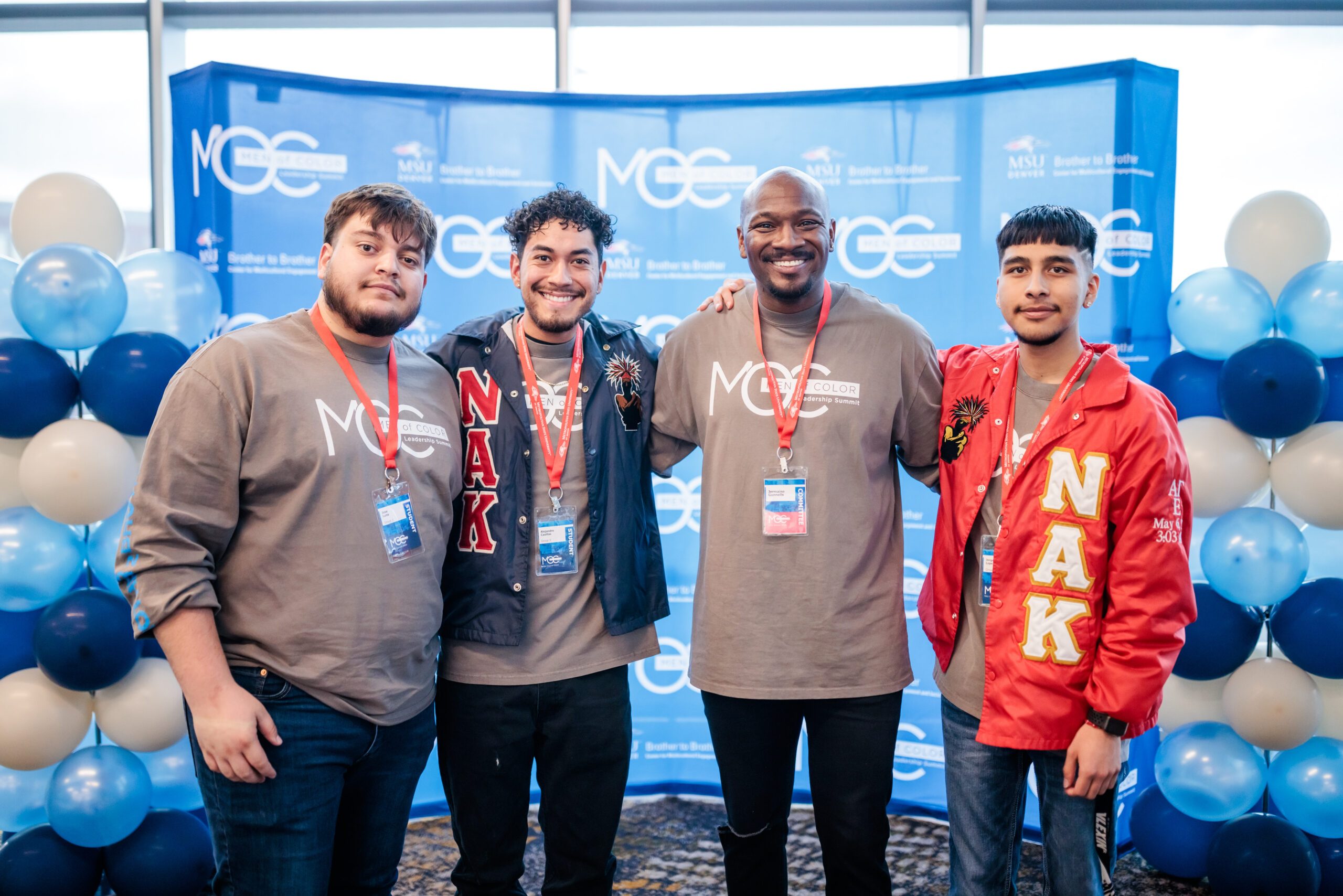 B2B director and students pose for picture at Men of Color Leadership summit