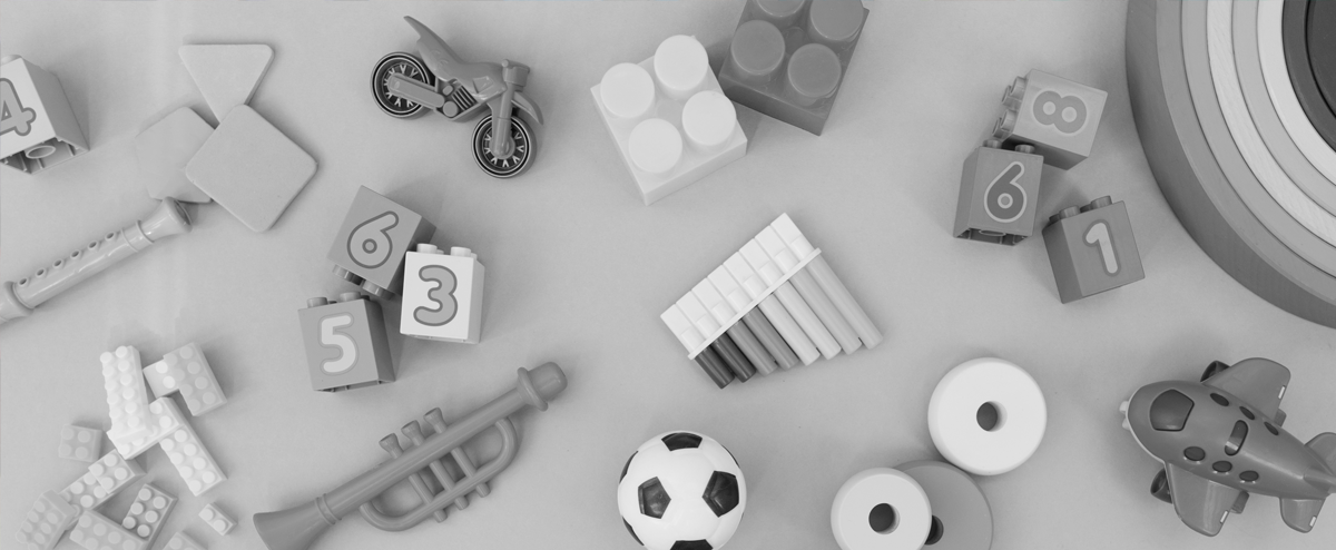 Decorative: image of a variety of children's toys laid out on a flat surface.