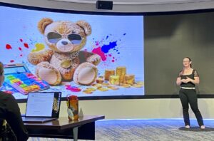 MPAcc alum Laura Girndner presenting in statewide 3MT competition in front of slide - Apr 2025