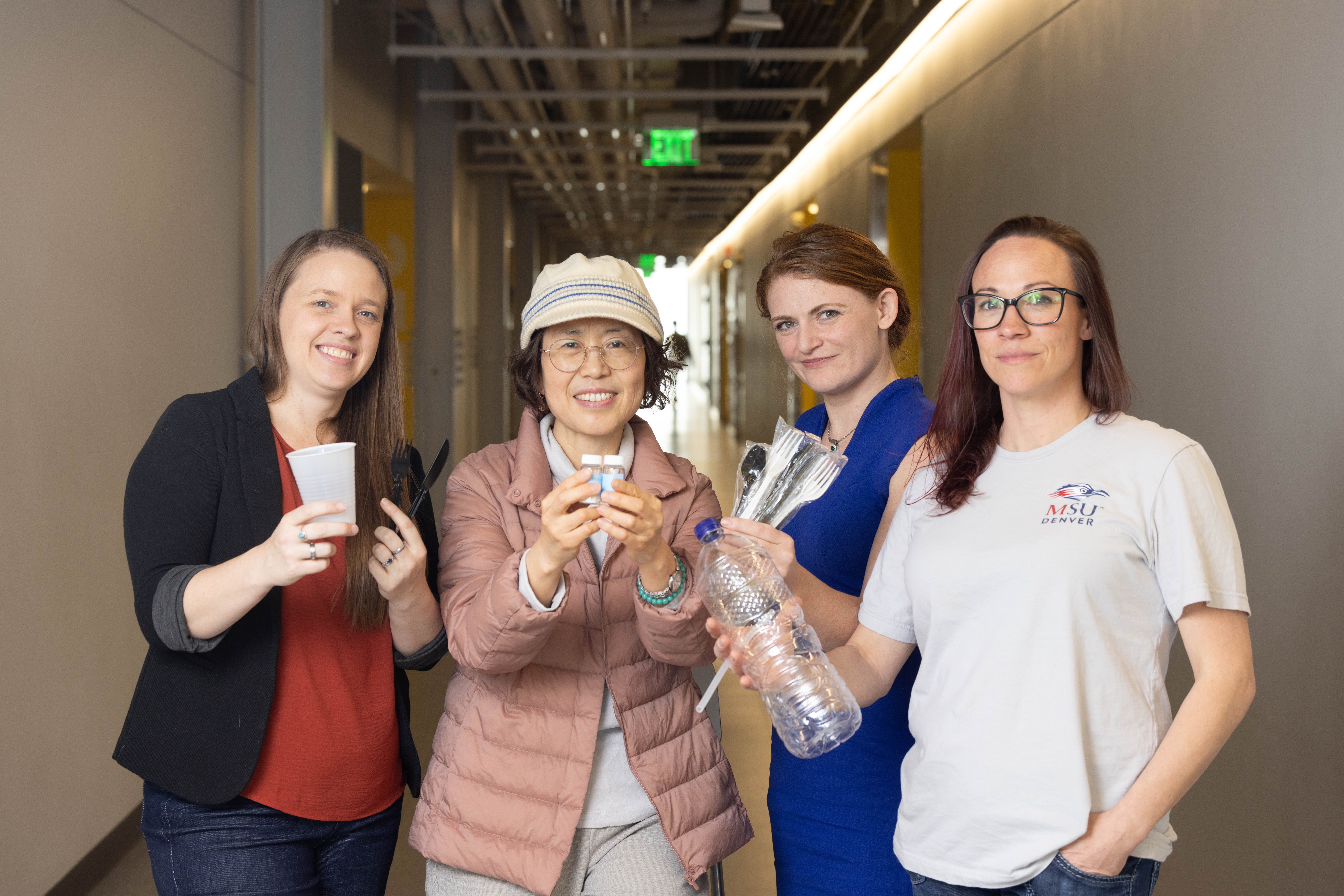 Director Sung Hee Joo poses for a picture with students
