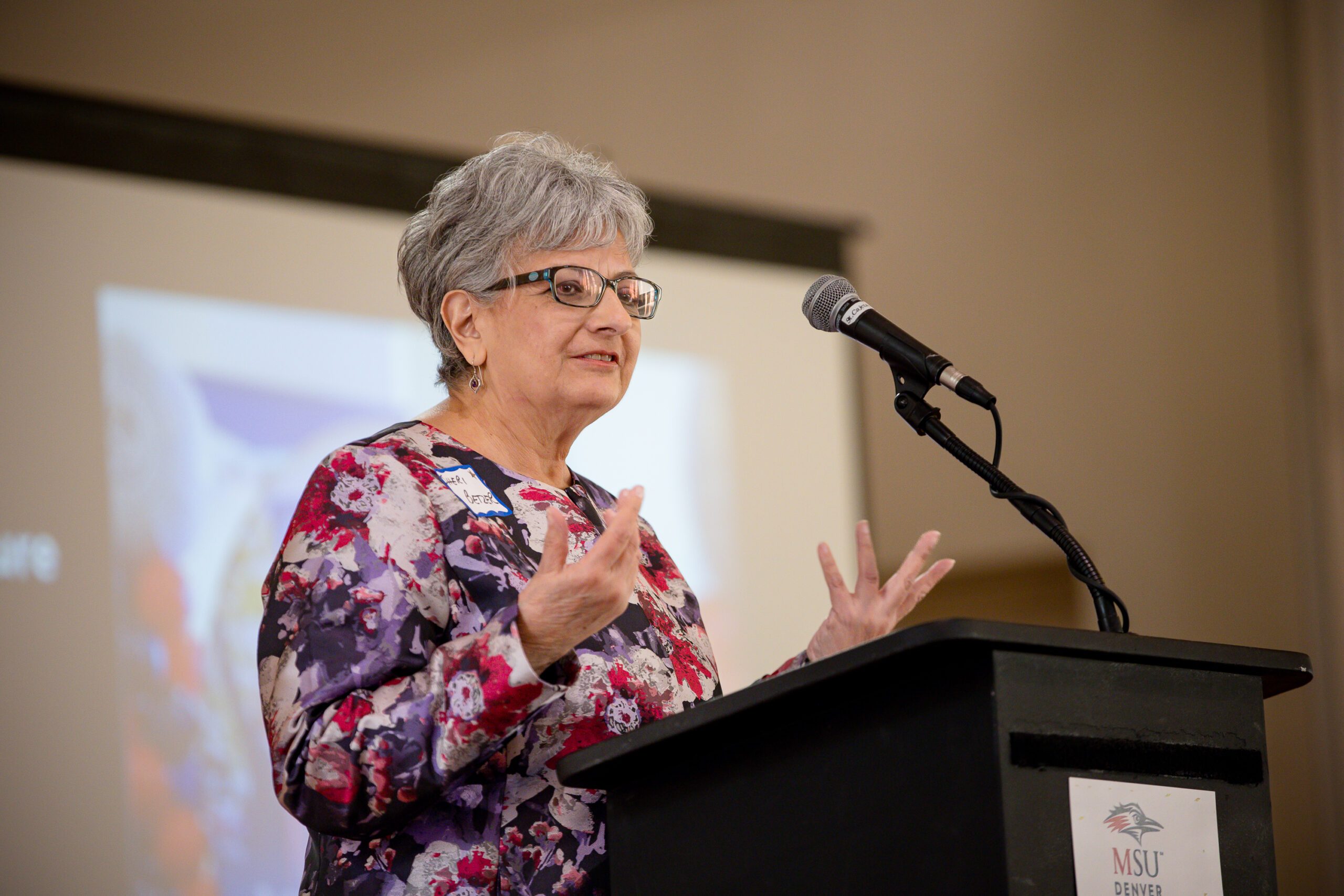 MPAcc's 15 year anniversary event - Sheri Betzer speaking at the podium
