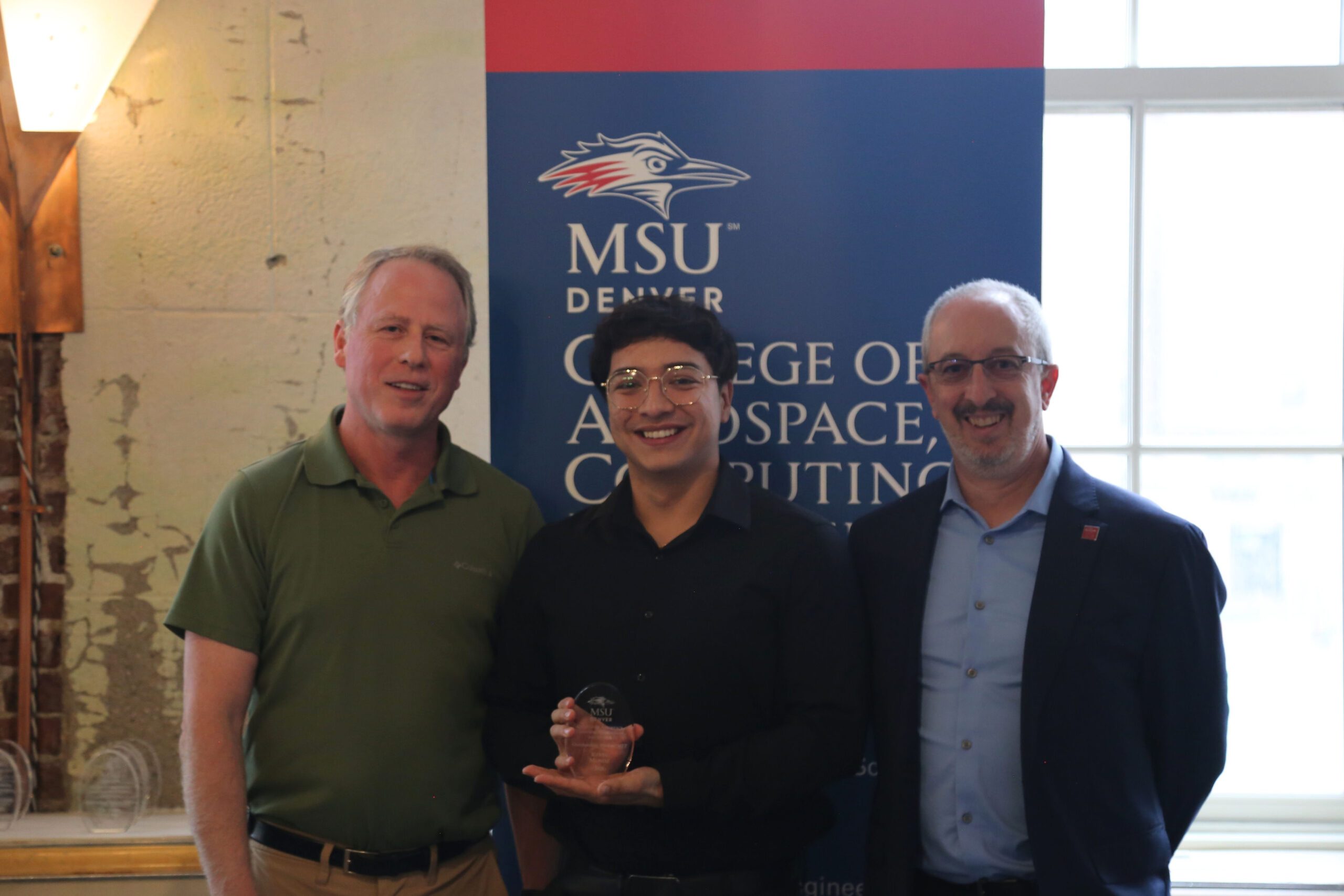 Dr Barlow and Dean Newcomer standing with Student at CACED Awards (3)