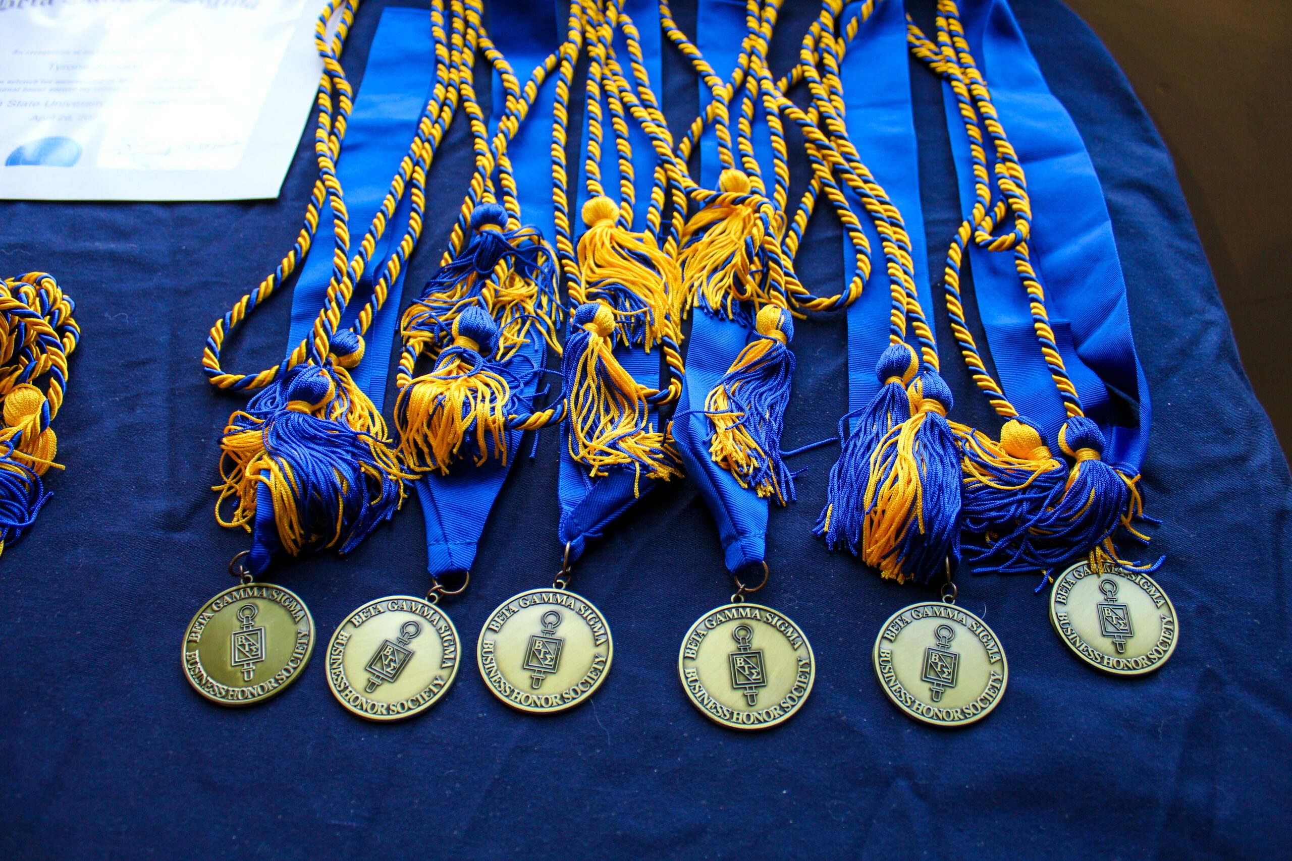 A photo of the medals and cords for the graduating BGS members