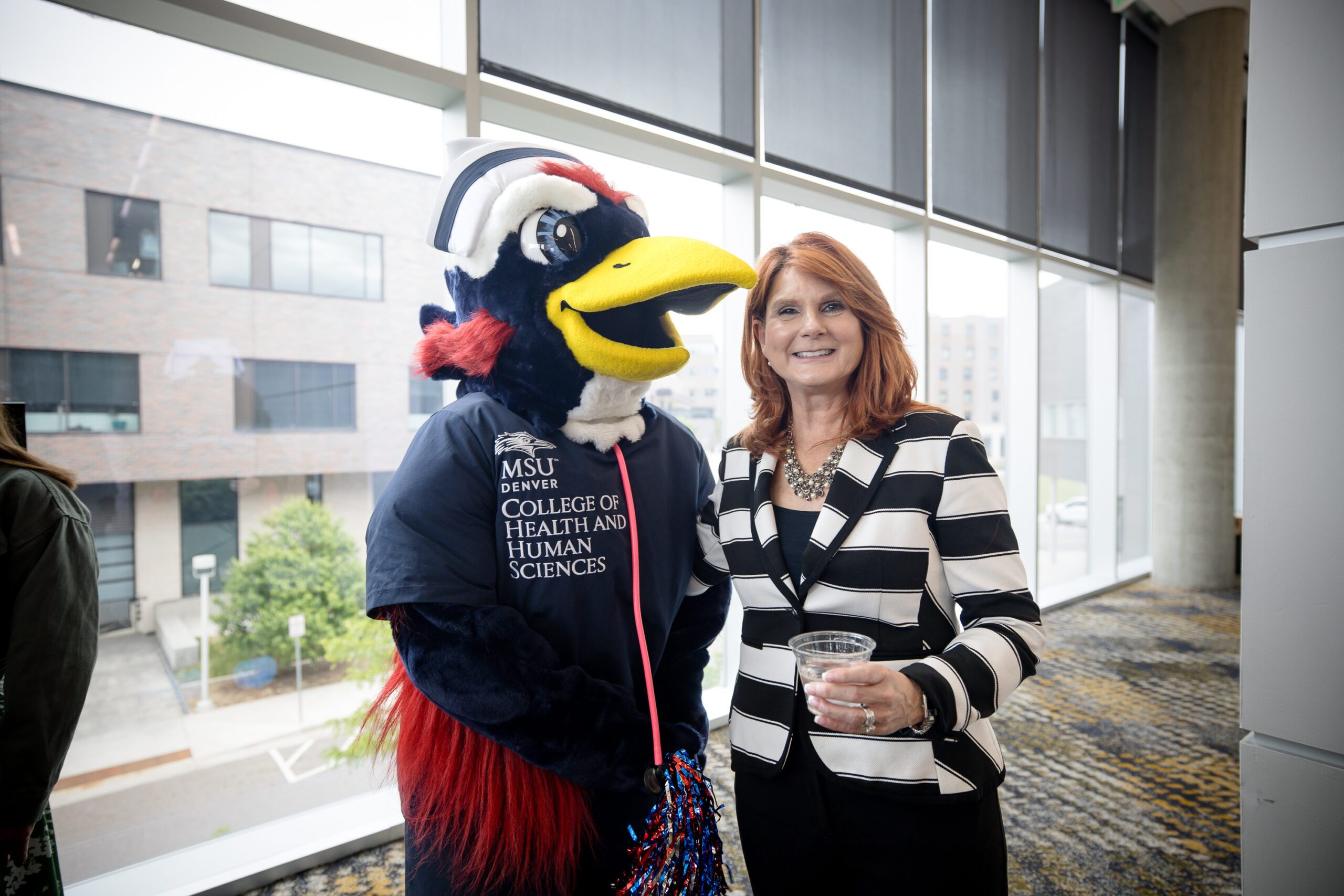 Nurse Rowdy (left) and CHHS Dean Hope Szypulski celebrating at the 2025 Outstanding Student Awards in the SpringHill Suites. Photo: Sara Hertwig