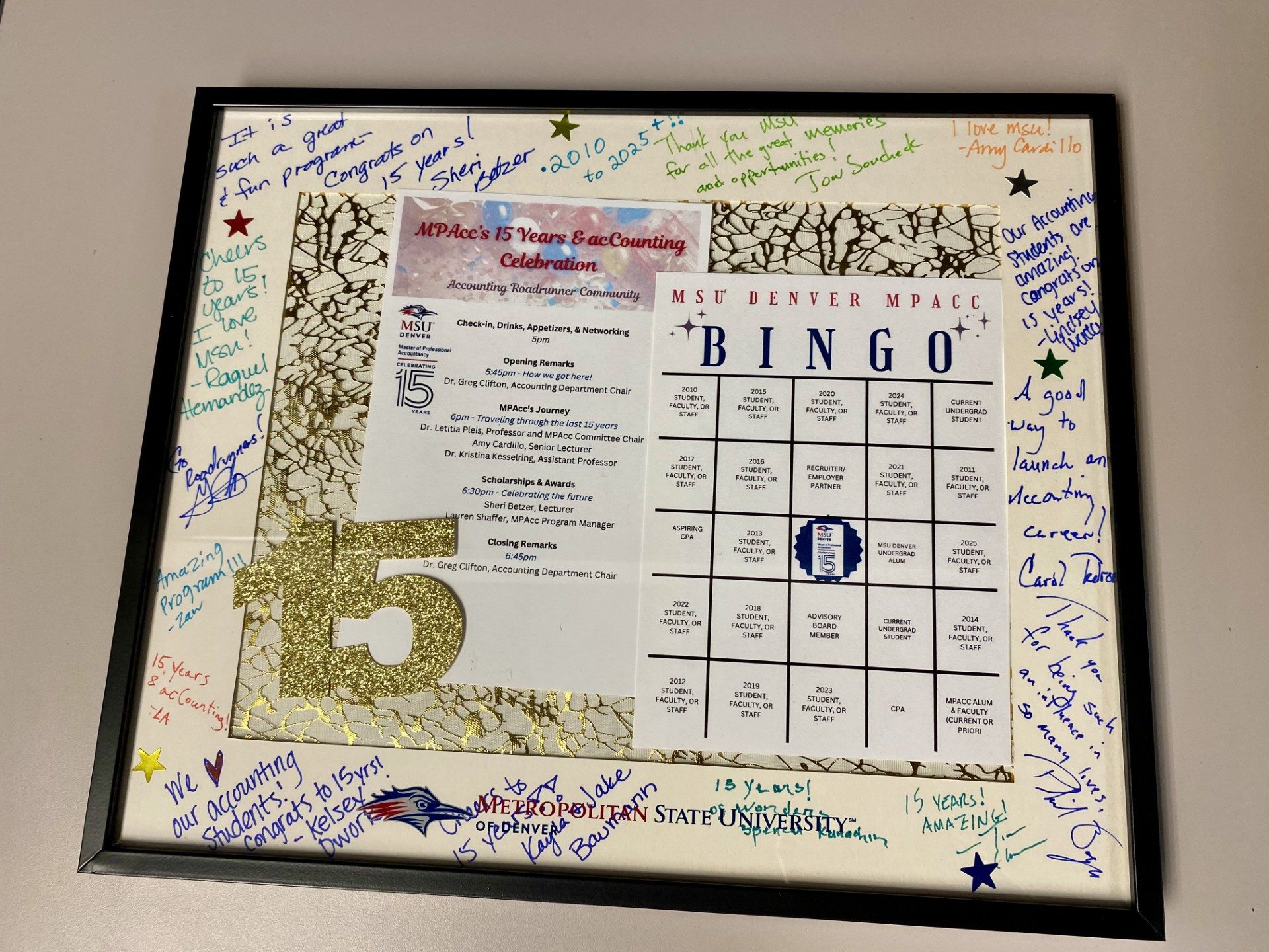 MPAcc's 15 anniversary event - program and bingo in frame with signed mat