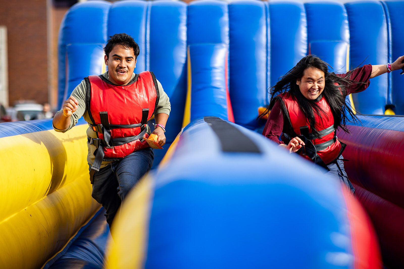 MSU Denver Rowdy mascot chats with a student at a campus event booth. Photo by Alyson McClaran