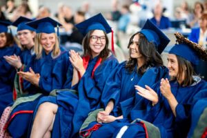 MS SLP graduates clapping for Jackie Pena-Sosa during the MS SLP Hooding Ceremony
