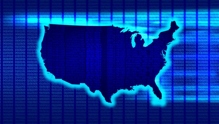 Binary code on a computer screen with an outline of the United States in the center.