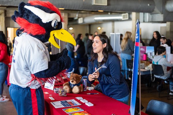 Rowdy visits resource booths at the Spring 2025 Open House
