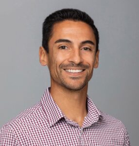An headshot photo showing Richard Miccio, Director of Recreation and Well-being, in front of a grey background.