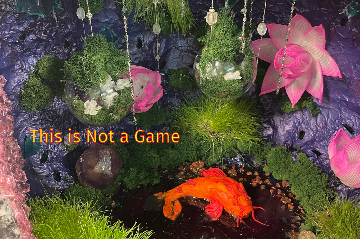 A colorful, surreal environment with text that reads, this is not a game.