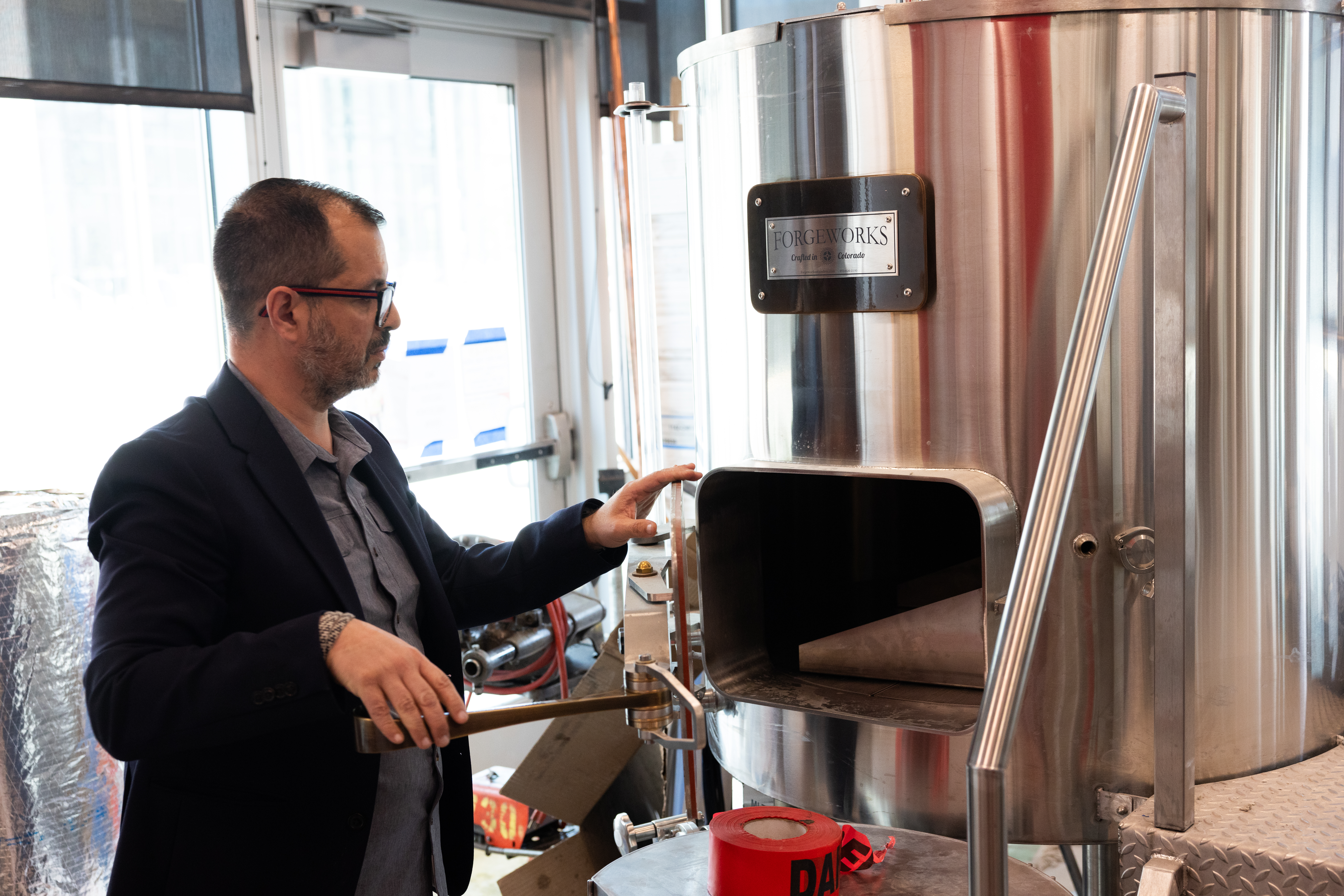 Professor checking out equipment at the Charlie Papazian Brewing Education Lab
