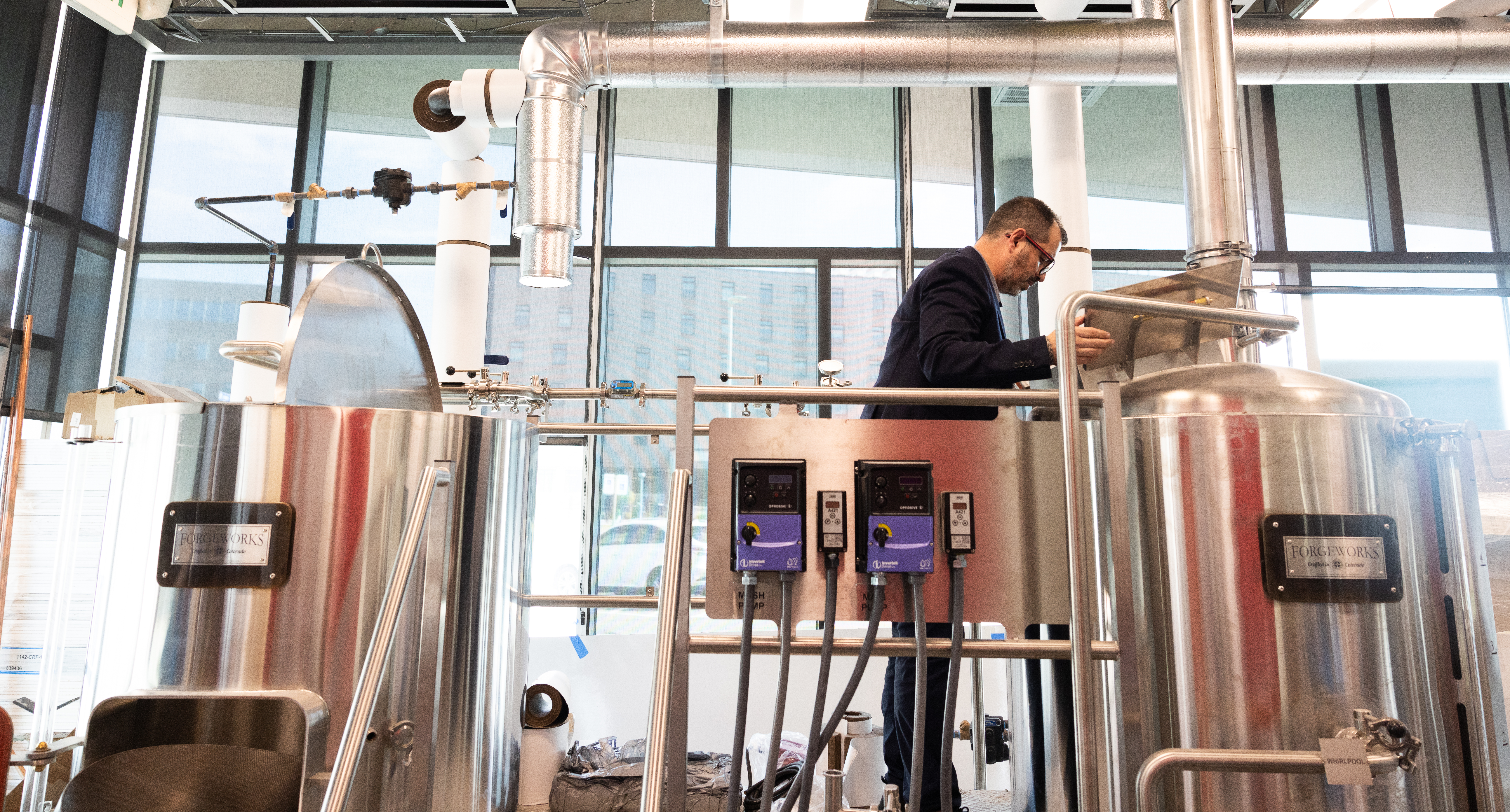 Professor checking out equipment at the Charlie Papazian Brewing Education Lab