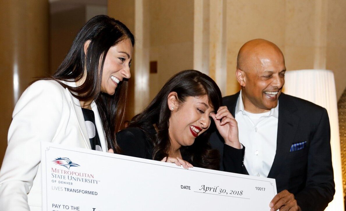 school of hospitality Dimond scholarship recipient with large check
