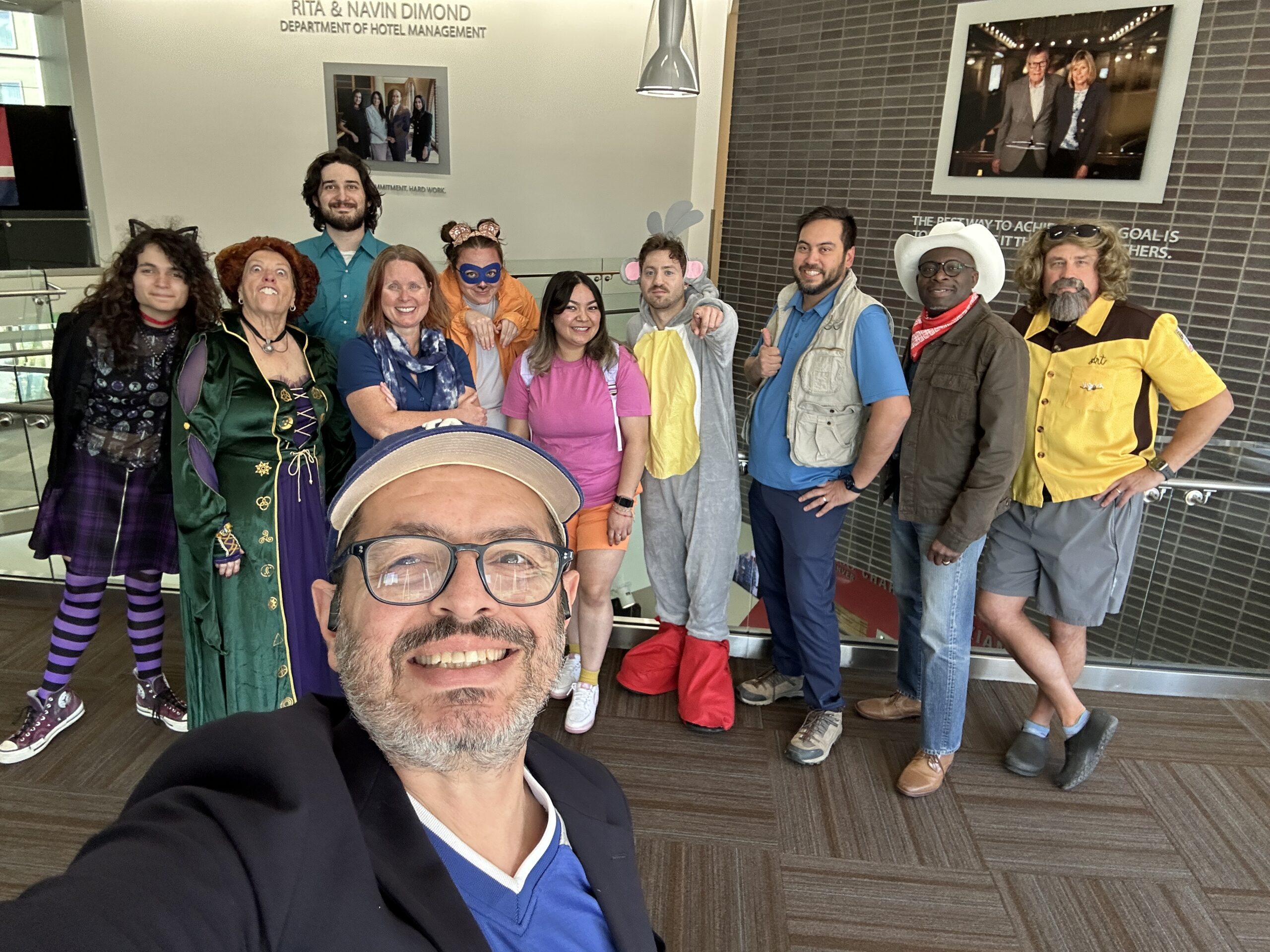 group of school of hospitality faculty and staff in halloween costumes