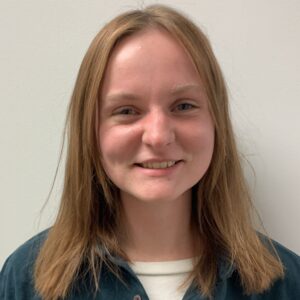 A young woman with medium-length blonde hair.