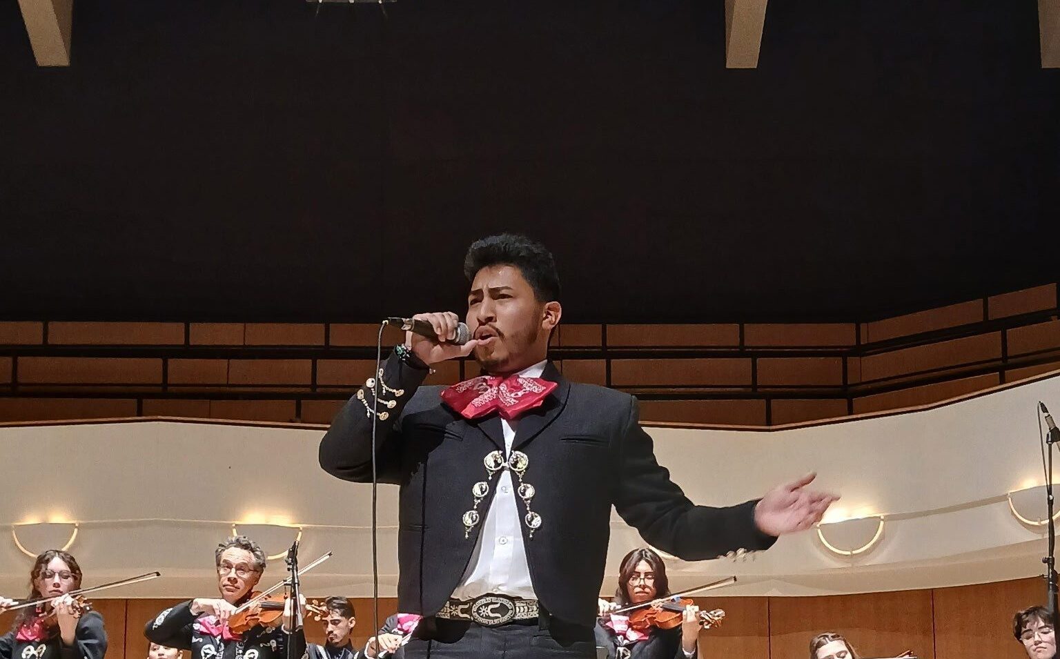 Photo of a mariachi band and singer