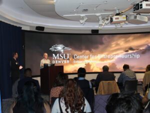 Presenter opening for the Pitch and Poster Competition.