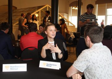 Northwestern Mutual staff talking with students.