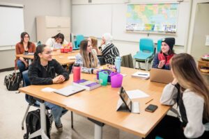 Students sitting together in a discussion.