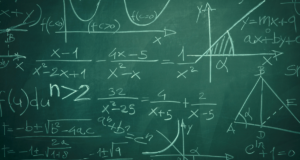 mathematical equations in white written on a green chalkboard