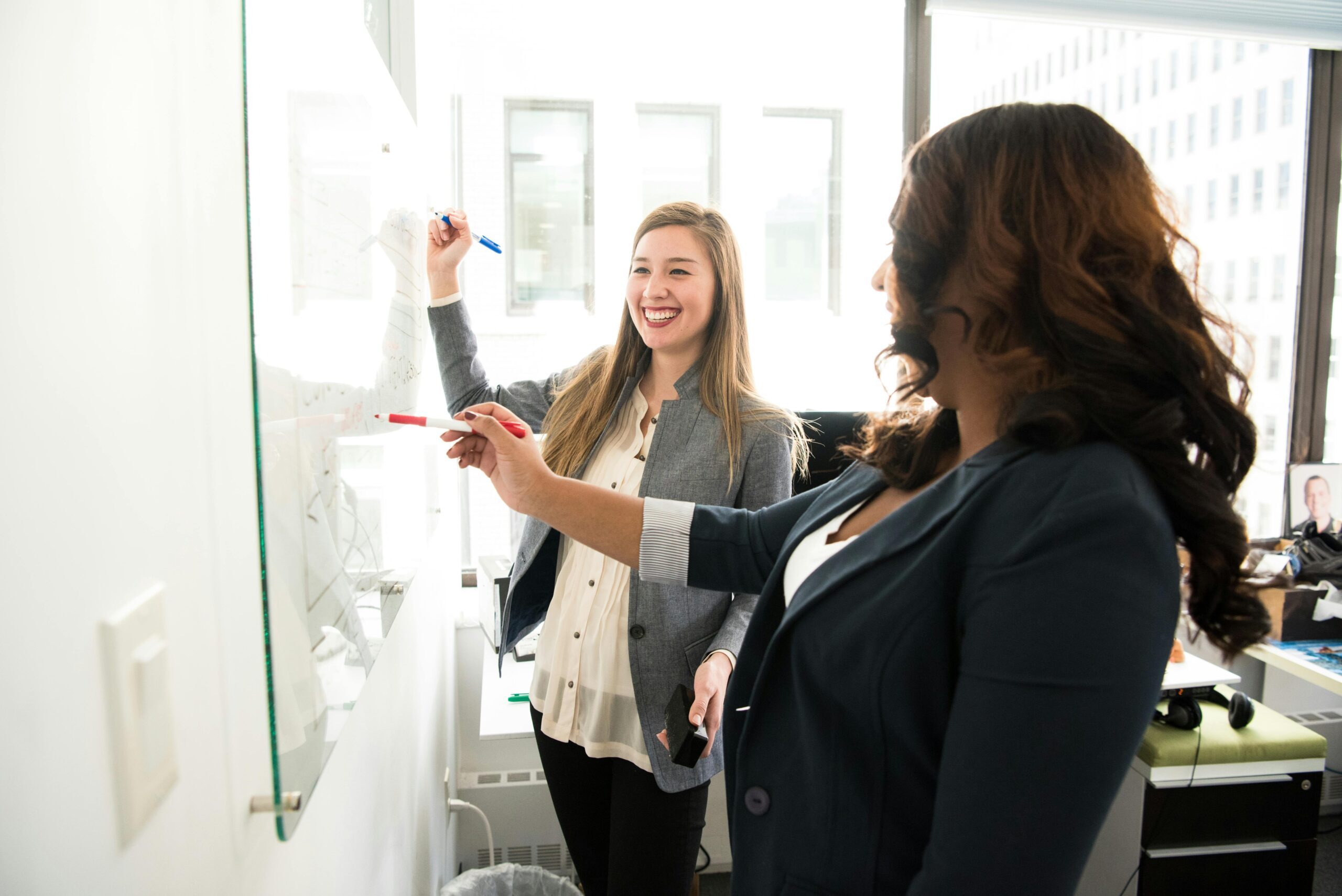 Picture of two ladies collaborating on a project