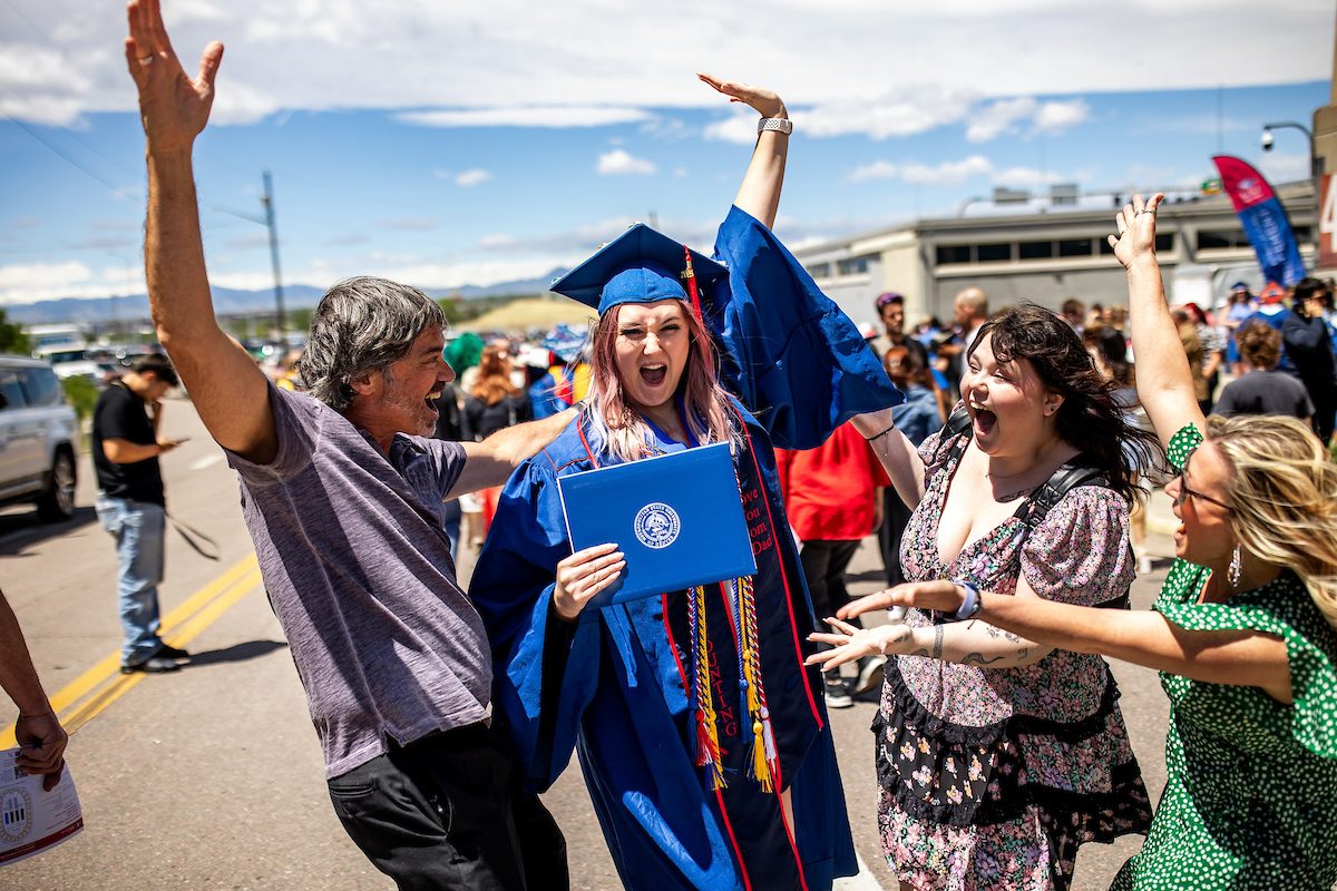MSU Denver student celebrating graduation with family