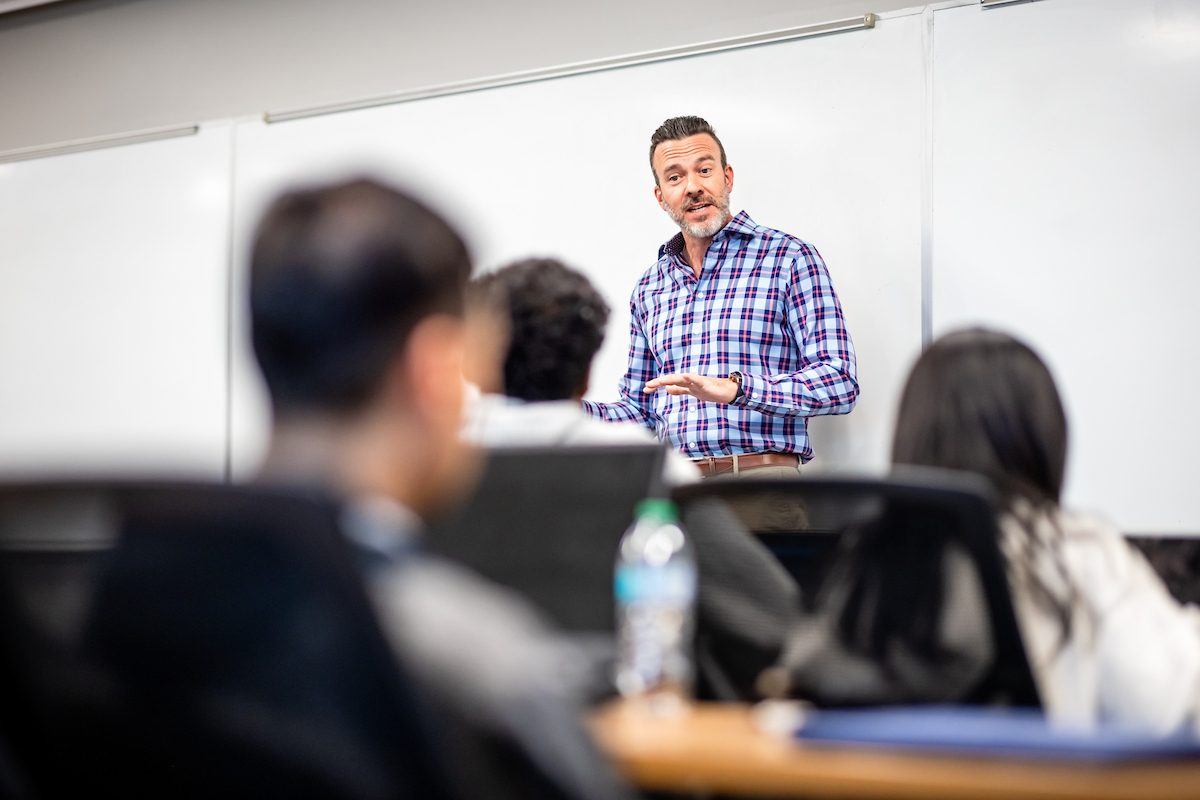 Guest speaker in finance class talking to students in a lecture