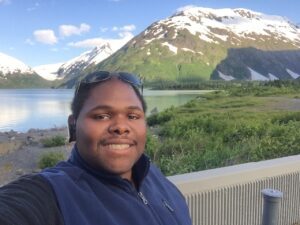 Curtis Walker with a snow-capped mountain behind him