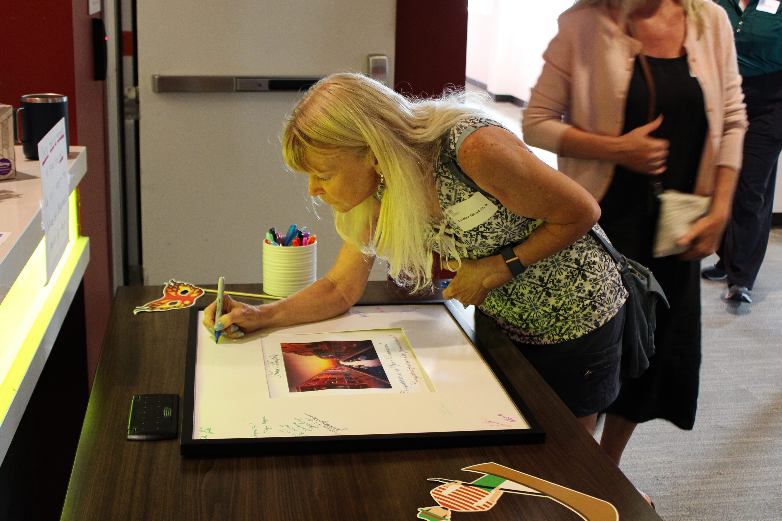 People posing for a photo at Ann Murphys retirement party